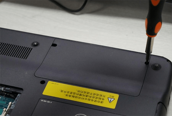 remove the screw on the hard disk cover with a screwdriver